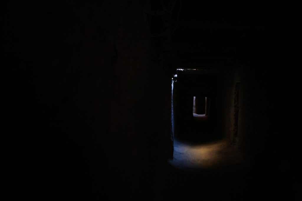 a dark tunnel with a light at the end