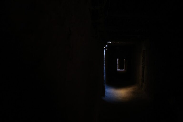 a dark tunnel with a light at the end