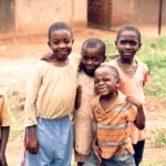 smiling boys wearing brown shirts